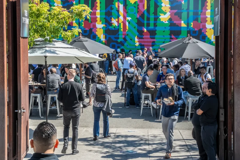 Attendees in the courtyard between sessions